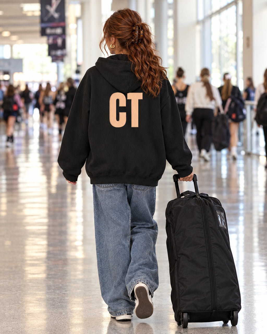 Lifestyle photo of the CT Monogram Puff Hoodie in Black