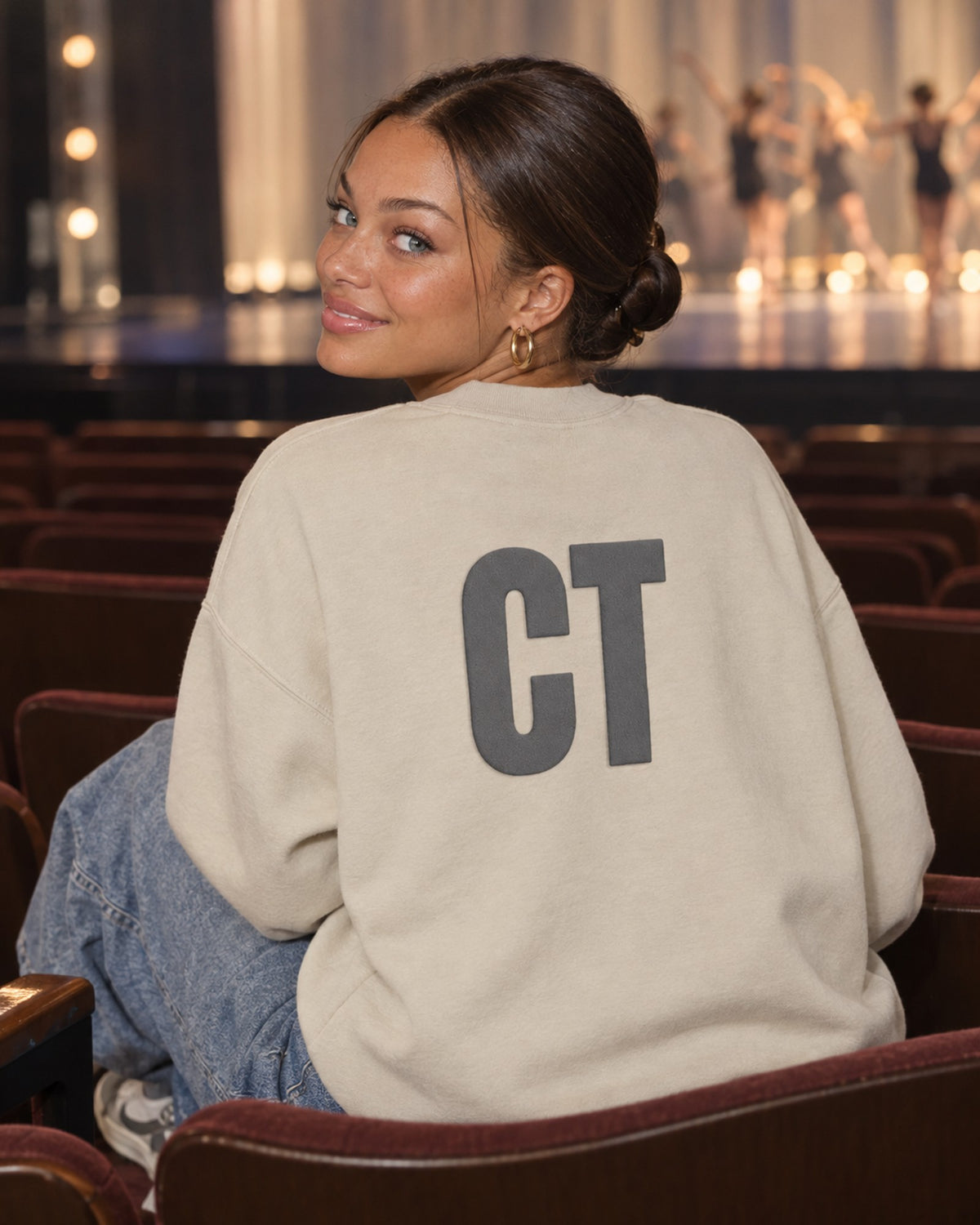 Lifestyle photo of the CT Monogram Puff Crewneck in Sand