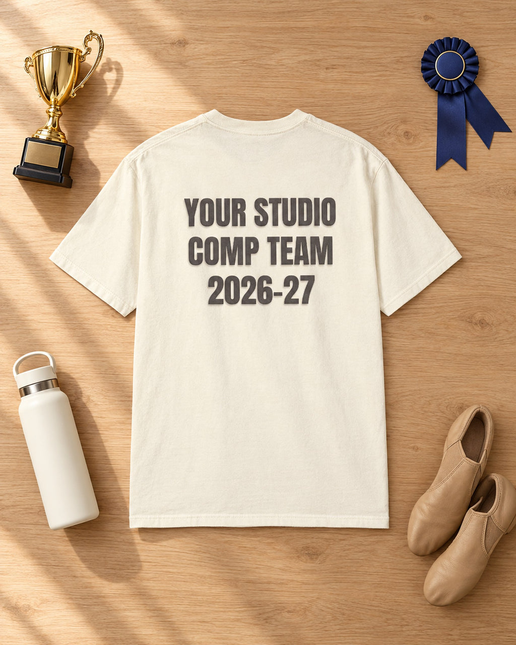 Flat lay of the Comp Team 2026-27 Personalized Puff Tee in Ivory