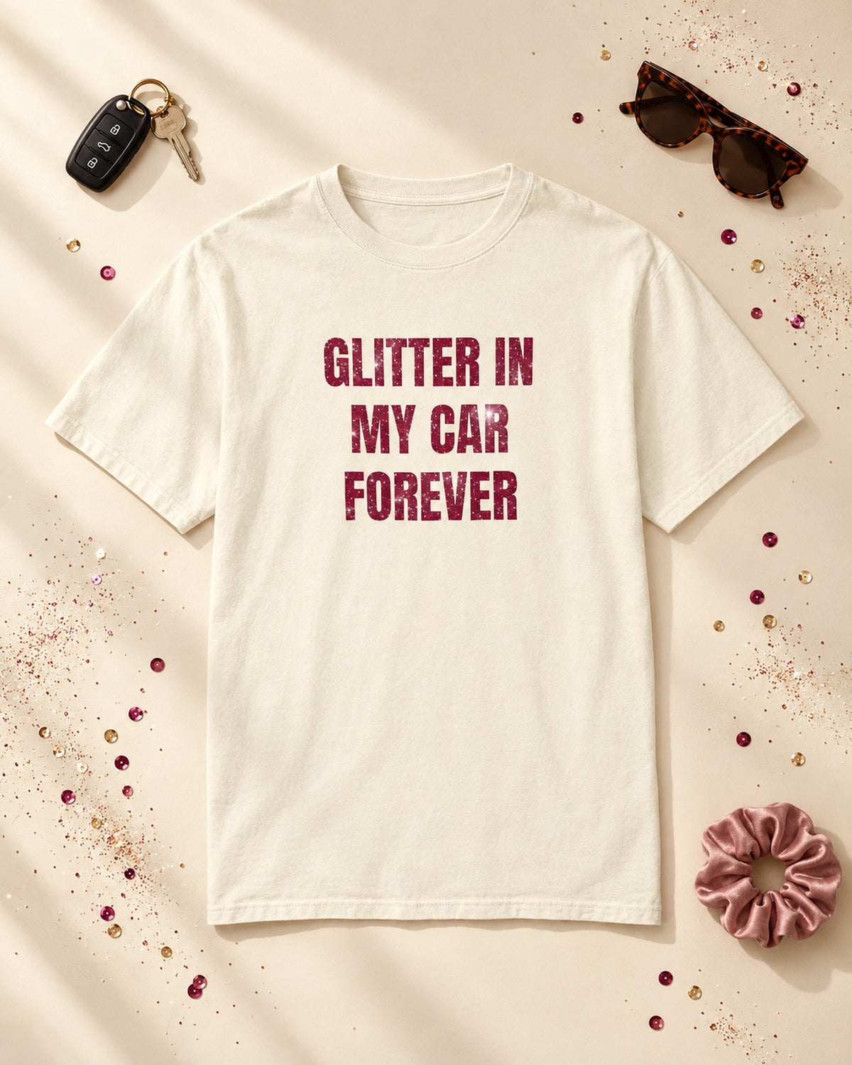 Flat lay of the Glitter in My Car Forever Glitter Tee in Ivory