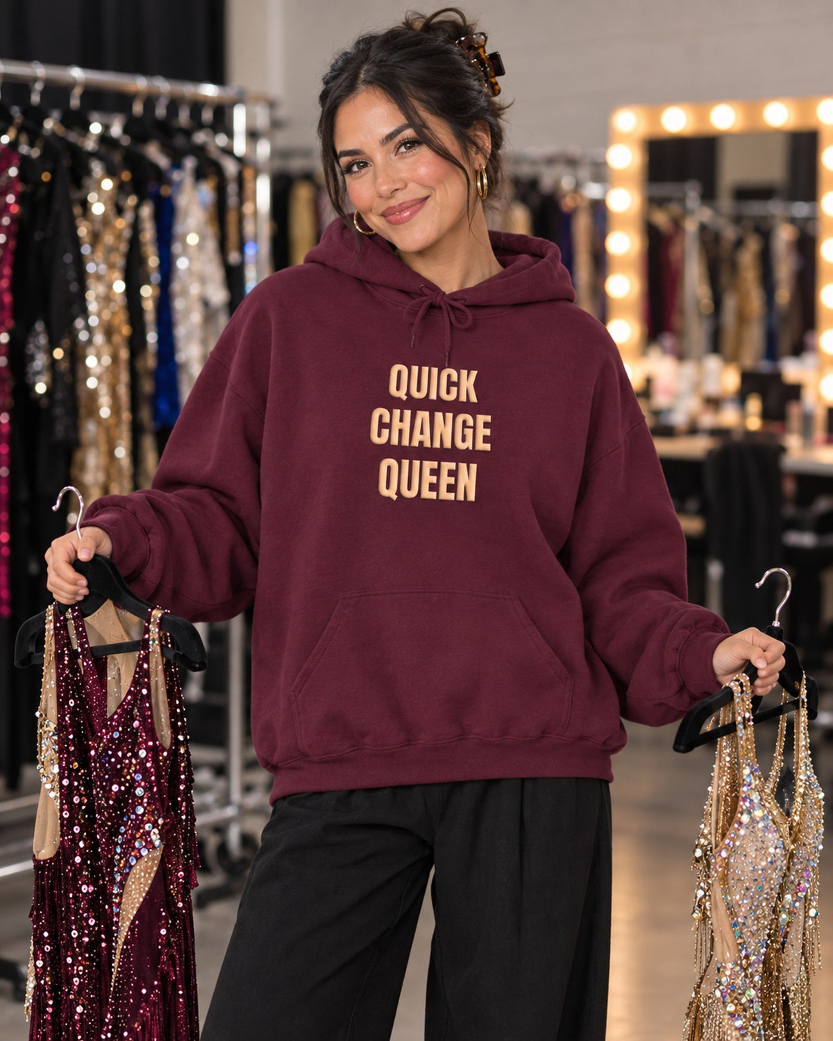 Lifestyle photo of the Quick Change Queen Puff Hoodie in Maroon