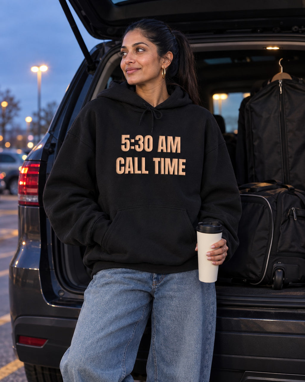 Lifestyle photo of the 5:30 AM Call Time Puff Hoodie in Black